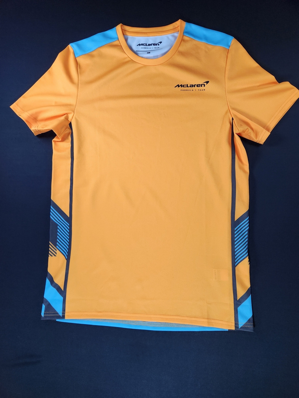 McLaren Men’s Orange Rash Guard with Blue Accents